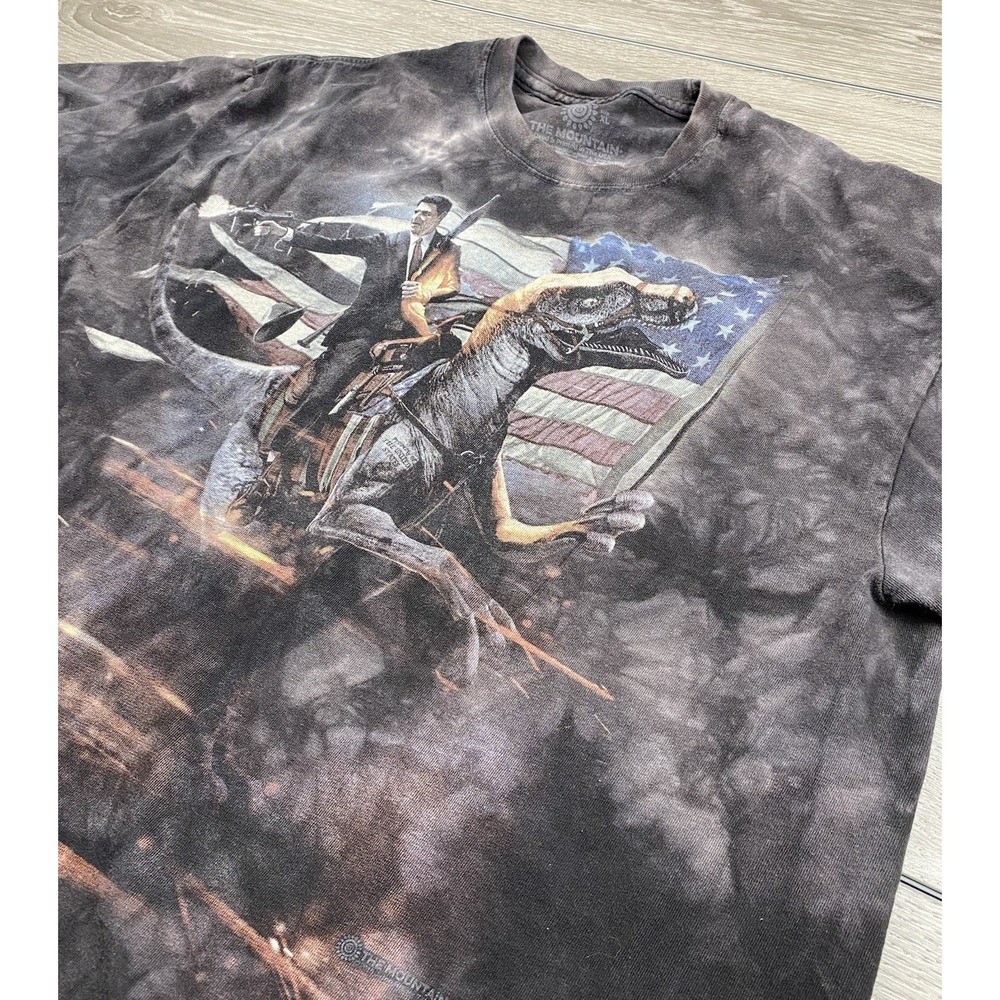 The Mountain Men's Short Sleeve Ronald Reagan Riding Dinosaur T Shirt Size XL